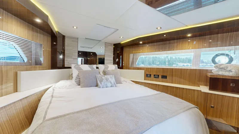  Yacht Photos Pics Luxurious bedroom interior of 2021 Cruisers Yachts 60 Cantius with modern design and elegant lighting.