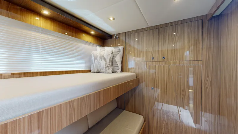  Yacht Photos Pics 2021 Cruisers Yachts 60 Cantius interior cabin with wood paneling and modern lighting.