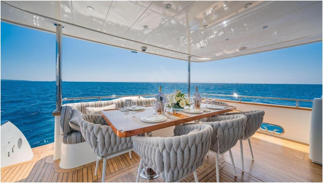 Luxurious dining area on 2012 Explorer Trawler 67-70' yacht with ocean view.