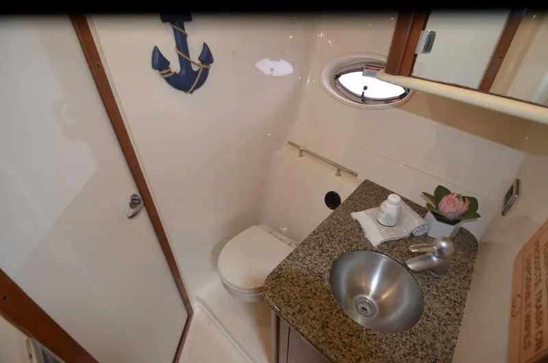  Yacht Photos Pics 2007 Sea Ray 38 Sundancer bathroom with granite countertop and stainless steel sink.