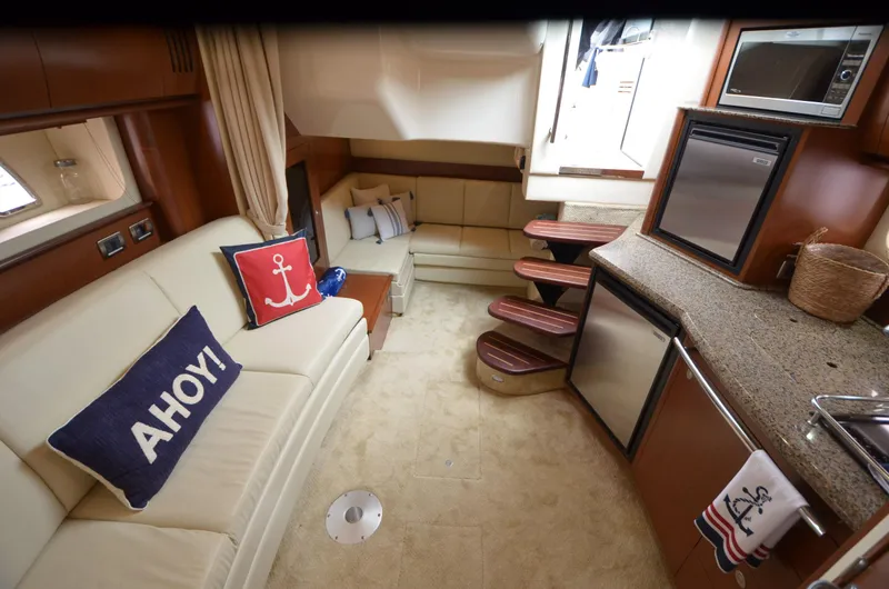  Yacht Photos Pics Interior of 2007 Sea Ray 38 Sundancer yacht with cozy seating and modern kitchen amenities.