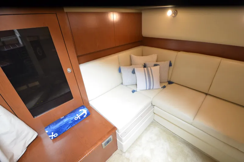  Yacht Photos Pics Interior of 2007 Sea Ray 38 Sundancer with beige seating and nautical-themed decor.