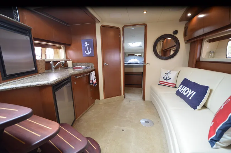  Yacht Photos Pics 2007 Sea Ray 38 Sundancer interior with kitchen, seating, nautical decor, and cozy cabin.