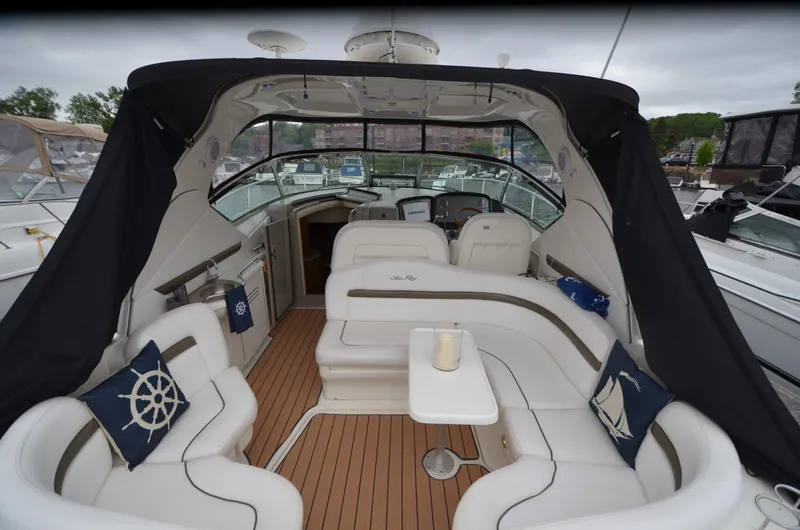  Yacht Photos Pics 2007 Sea Ray 38 Sundancer yacht interior with white seating and nautical-themed pillows.