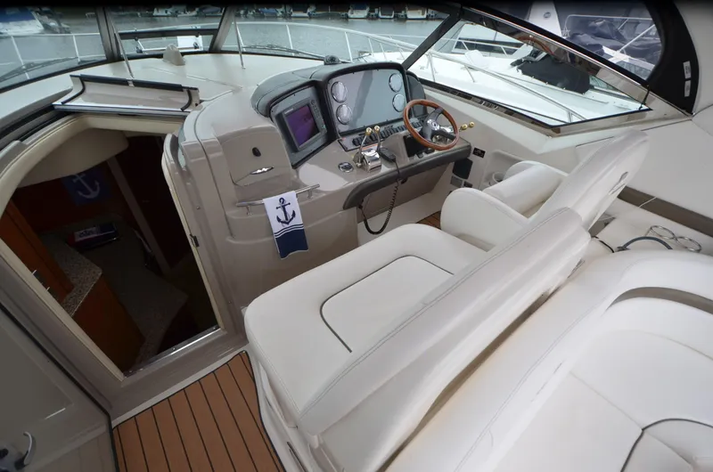  Yacht Photos Pics 2007 Sea Ray 38 Sundancer cockpit with helm, steering wheel, and navigation equipment.