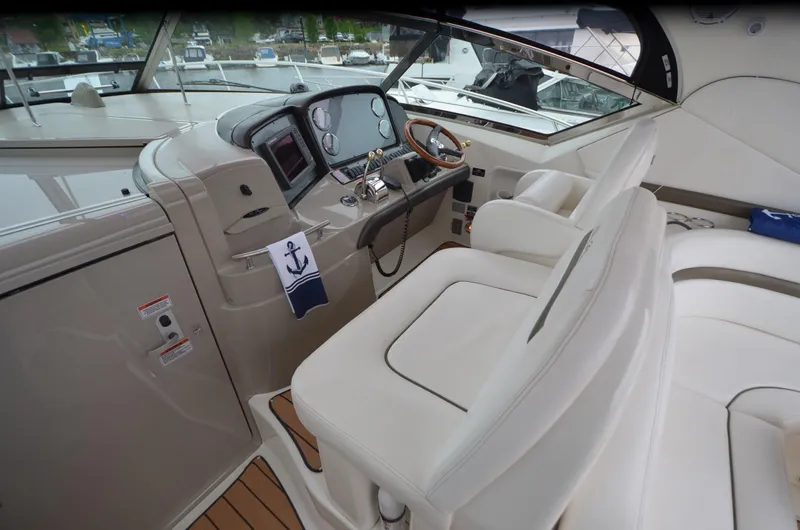  Yacht Photos Pics 2007 Sea Ray 38 Sundancer helm with white seating and modern controls.