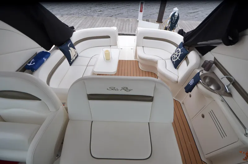  Yacht Photos Pics 2007 Sea Ray 38 Sundancer interior with white seating and nautical-themed decor.