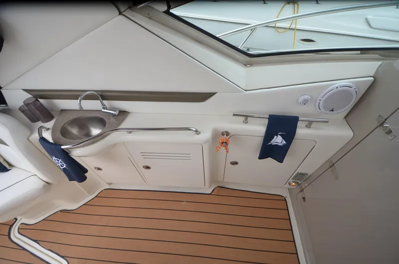  Yacht Photos Pics 2007 Sea Ray 38 Sundancer interior with sink, wooden flooring, and nautical decor.