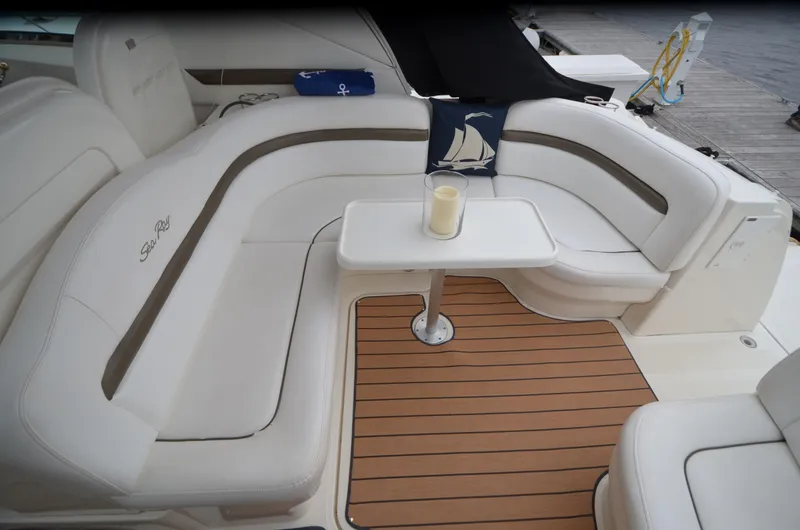  Yacht Photos Pics Luxurious seating area on 2007 Sea Ray 38 Sundancer yacht with elegant table and candle.