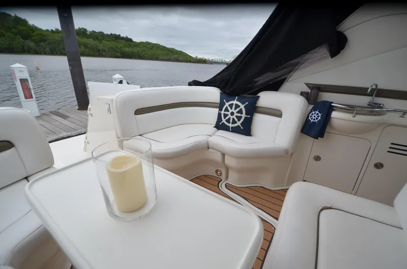  Yacht Photos Pics Luxurious 2007 Sea Ray 38 Sundancer yacht interior with white seating and nautical decor.