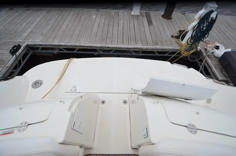  Yacht Photos Pics 2007 Sea Ray 38 Sundancer yacht docked at a wooden pier.