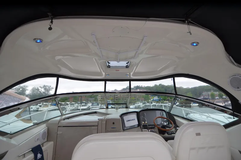  Yacht Photos Pics Interior view of 2007 Sea Ray 38 Sundancer yacht cockpit with modern controls and seating.