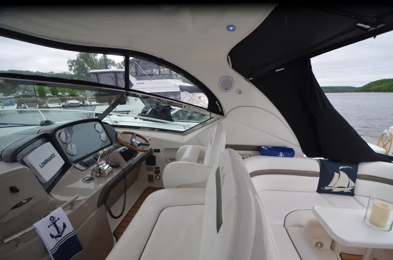  Yacht Photos Pics Luxurious 2007 Sea Ray 38 Sundancer yacht interior with plush seating and modern dashboard.