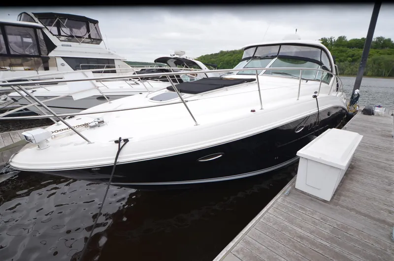 Yacht Photos Pics 2007 Sea Ray 38 Sundancer yacht docked at marina, sleek design, white and black exterior.