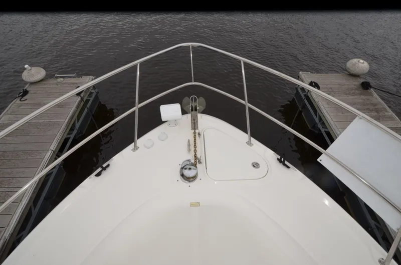  Yacht Photos Pics Bow view of 2007 Sea Ray 38 Sundancer docked between two piers.