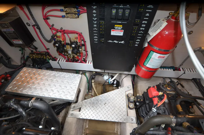 Yacht Photos Pics Engine room of 2007 Sea Ray 38 Sundancer with control panel and fire extinguisher.