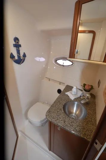  Yacht Photos Pics 2007 Sea Ray 38 Sundancer bathroom with granite countertop and nautical decor.