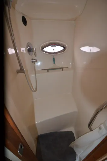  Yacht Photos Pics Shower area in 2007 Sea Ray 38 Sundancer yacht with porthole and fixtures.
