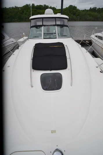  Yacht Photos Pics 2007 Sea Ray 38 Sundancer yacht docked, featuring sleek white deck and black sunpad.