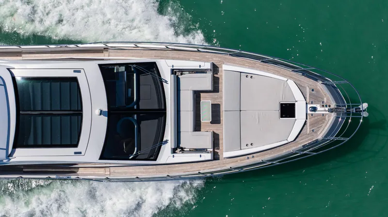 Swaha Yacht Photos Pics Top view of 2018 Azimut S7 yacht cruising on green water.