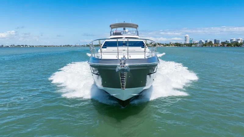 Swaha Yacht Photos Pics 2018 Azimut S7 yacht cruising on open water under clear blue skies.
