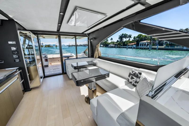 Swaha Yacht Photos Pics Luxurious interior of 2018 Azimut S7 yacht with modern seating and scenic water views.
