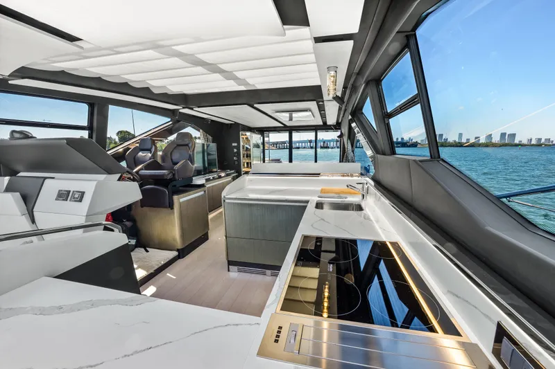 Swaha Yacht Photos Pics Luxurious interior of 2018 Azimut S7 yacht with modern kitchen and panoramic windows.