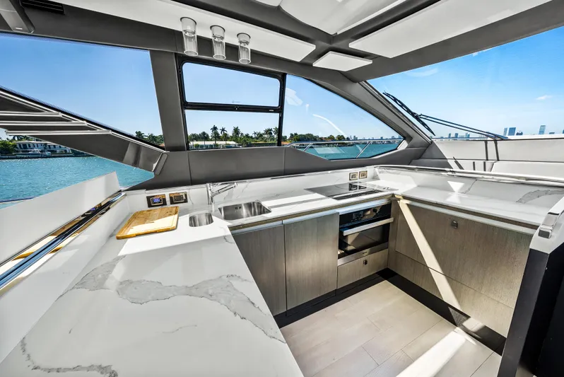 Swaha Yacht Photos Pics Luxurious kitchen interior of 2018 Azimut S7 yacht with modern appliances and ocean view.