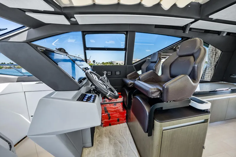 Swaha Yacht Photos Pics Interior cockpit of 2018 Azimut S7 yacht with modern steering and seating.
