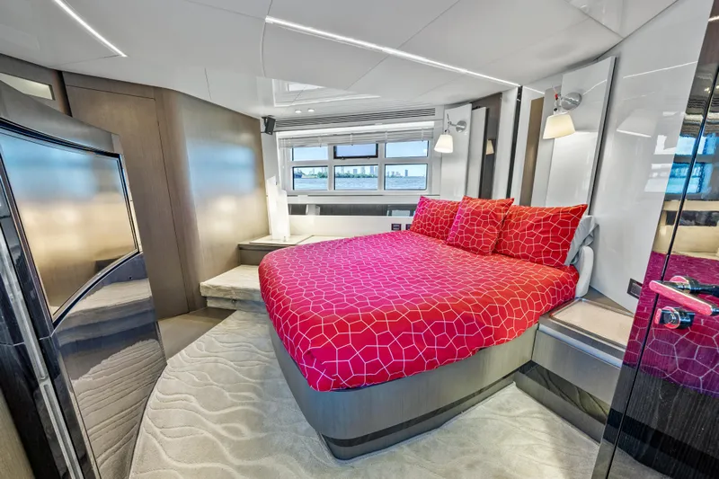 Swaha Yacht Photos Pics Luxurious bedroom interior of 2018 Azimut S7 yacht with modern design and vibrant red bedding.