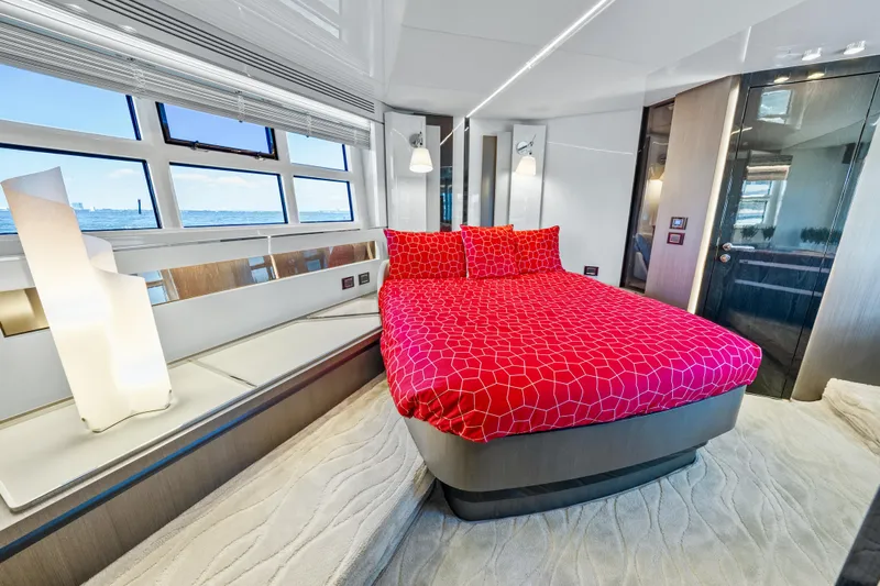 Swaha Yacht Photos Pics Luxurious 2018 Azimut S7 yacht bedroom with red bedding and modern decor.