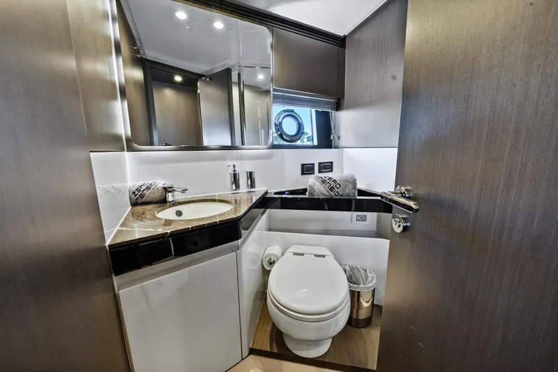 Swaha Yacht Photos Pics Luxurious bathroom in 2018 Azimut S7 yacht with modern fixtures and elegant design.