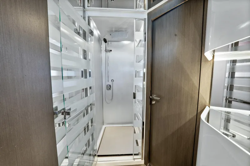 Swaha Yacht Photos Pics Luxurious shower area in 2018 Azimut S7 yacht with modern design and glass door.