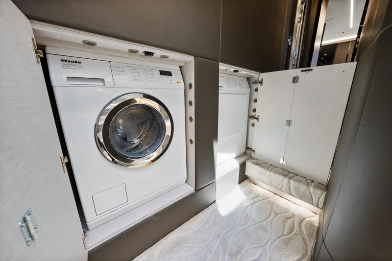 Swaha Yacht Photos Pics Laundry area with Miele washer in 2018 Azimut S7 yacht.