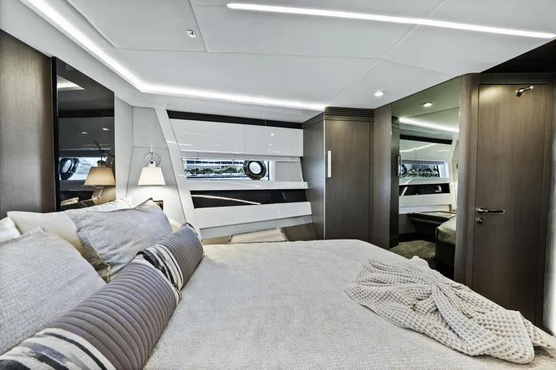 Swaha Yacht Photos Pics Luxurious bedroom interior of 2018 Azimut S7 yacht with modern design and elegant furnishings.