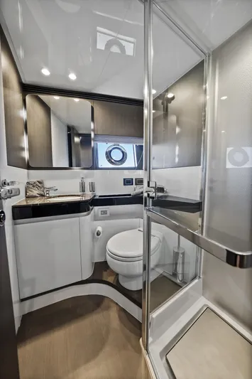 Swaha Yacht Photos Pics Luxurious bathroom in 2018 Azimut S7 yacht with modern fixtures and glass shower.