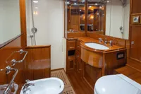 Luxurious wooden bathroom interior on 1929 Camper & Nicholsons J Class yacht.