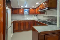Luxurious wooden kitchen interior on a 1929 Camper & Nicholsons J Class yacht.