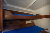 Interior of 1929 Camper & Nicholsons J Class yacht with wooden bunk beds.