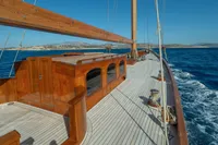 Elegant 1929 Camper & Nicholsons J Class yacht sailing on open sea.