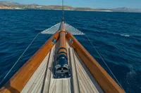Bow view of 1929 Camper & Nicholsons J Class yacht sailing on open sea.