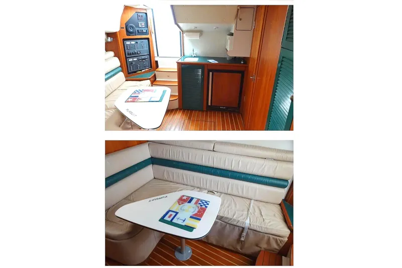  Yacht Photos Pics 1997 Pursuit 3000 Express cabin interior with seating, table, and kitchenette.