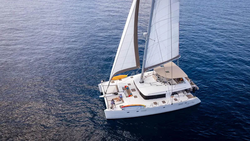 Copper Penny Yacht Photos Pics Sailing catamaran Lagoon 560, 2011 model, cruising on open sea.