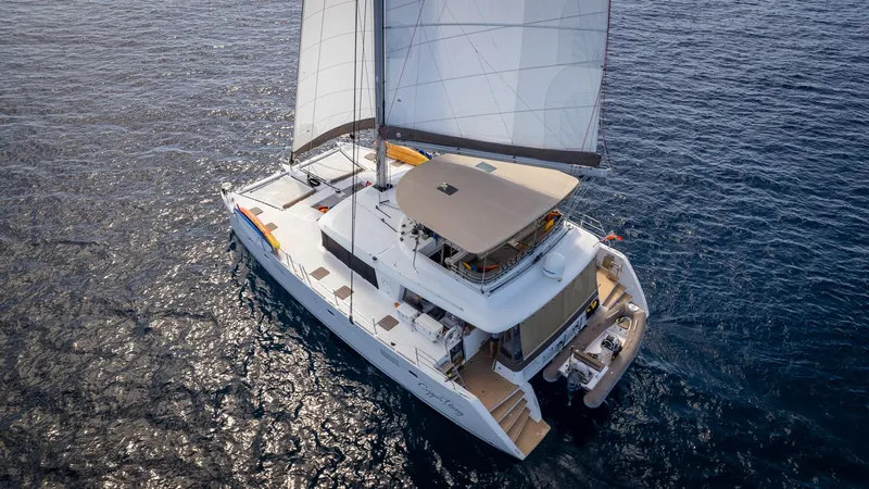 Copper Penny Yacht Photos Pics Sailing catamaran Lagoon 560, 2011 model, cruising on open sea.
