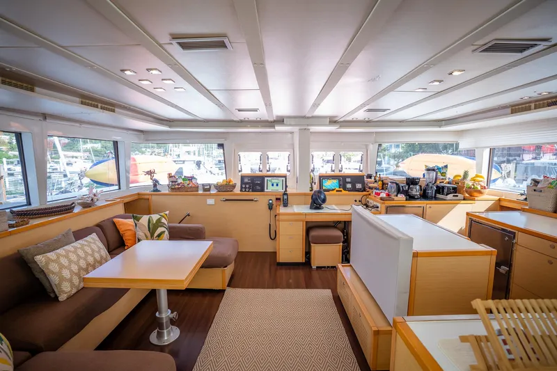 Copper Penny Yacht Photos Pics Luxurious interior of 2011 Lagoon 560 yacht with modern furnishings and panoramic windows.