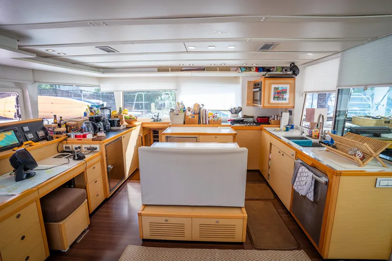 Copper Penny Yacht Photos Pics Interior of 2011 Lagoon 560 yacht with modern kitchen and seating area.
