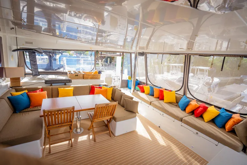 Copper Penny Yacht Photos Pics Luxurious Lagoon 560 yacht interior with colorful cushions and wooden furniture, 2011 model.