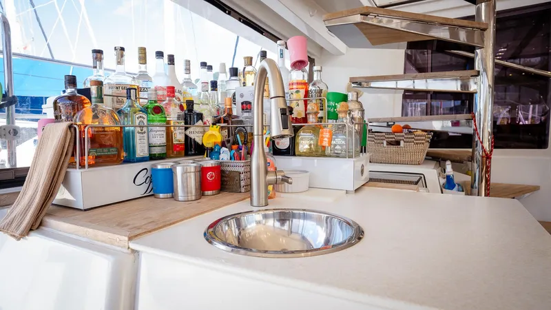 Copper Penny Yacht Photos Pics Luxurious Lagoon 560 yacht bar area with sink and assorted beverages, 2011 model.