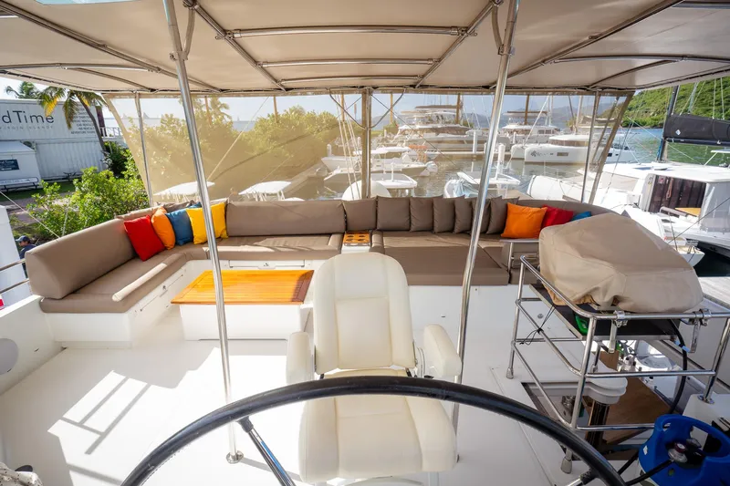 Copper Penny Yacht Photos Pics Spacious deck of 2011 Lagoon 560 yacht with seating and helm.