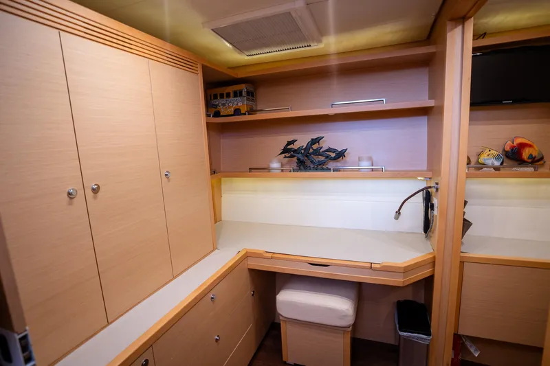 Copper Penny Yacht Photos Pics Interior of 2011 Lagoon 560 yacht with wooden cabinetry and workspace.